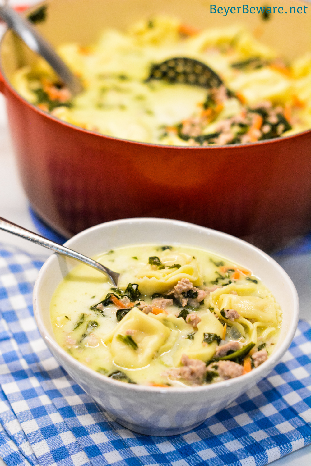 Sausage Tortellini Soup with spinach is a quick soup made on the stove all in one pot for a hearty, creamy soup full of spinach, sausage and cheese tortellini for an Italian sausage tortellini soup.