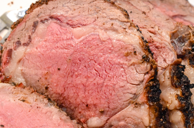 Knowing how to make a ribeye roast can mean a perfect beef holiday dinner entree that is perfectly cooked to a medium rare with a garlic and pepper crust all done on the Big Green Egg grill or the oven.