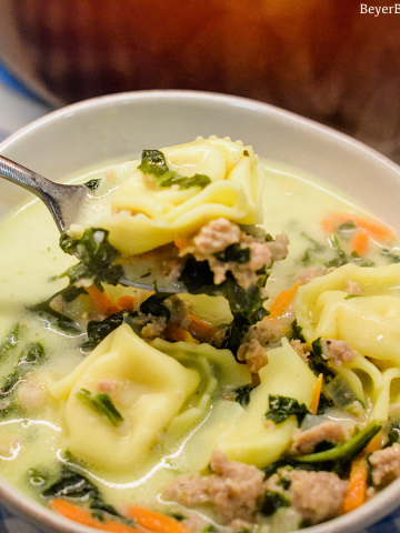 Sausage Tortellini Soup with spinach is a quick soup made on the stove all in one pot for a hearty, creamy soup full of spinach, sausage and cheese tortellini for an Italian sausage tortellini soup.