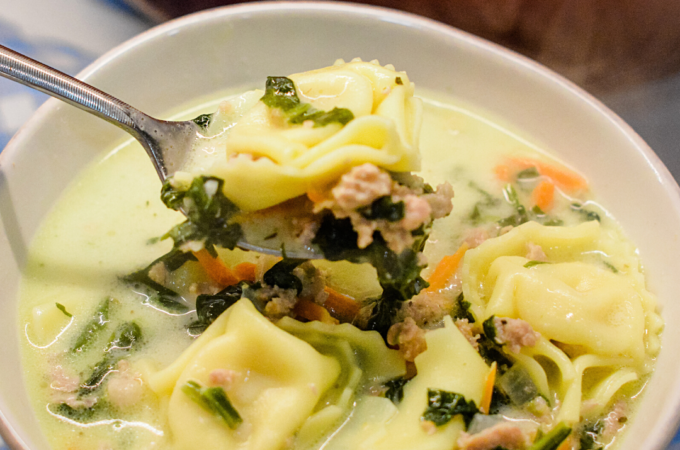 Sausage Tortellini Soup with spinach is a quick soup made on the stove all in one pot for a hearty, creamy soup full of spinach, sausage and cheese tortellini for an Italian sausage tortellini soup.
