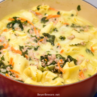 Sausage Tortellini Soup with spinach is a quick soup made on the stove all in one pot for a hearty, creamy soup full of spinach, sausage and cheese tortellini for an Italian sausage tortellini soup.