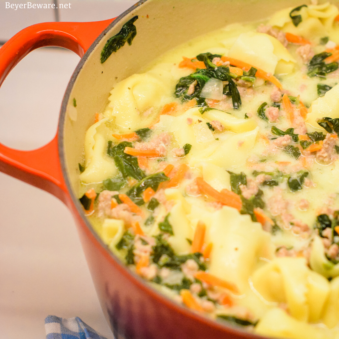 Sausage Tortellini Soup with spinach is a quick soup made on the stove all in one pot for a hearty, creamy soup full of spinach, sausage and cheese tortellini for an Italian sausage tortellini soup.