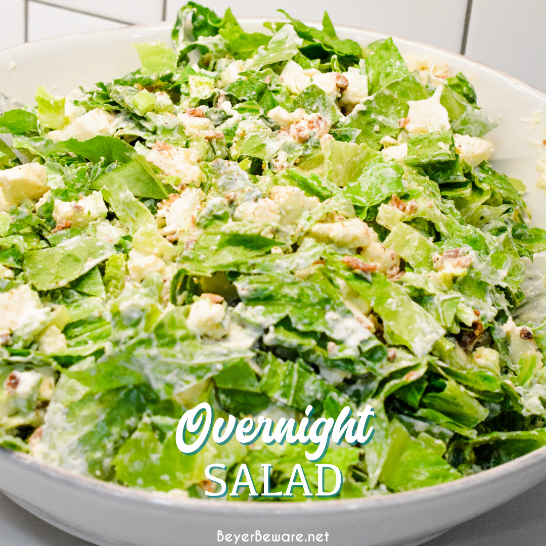 Overnight lettuce salad is my grandmother's version of 7 layer salad made with lettuce, cauliflower, mayonnaise, onions, celery, bacon, and parmesan cheese.