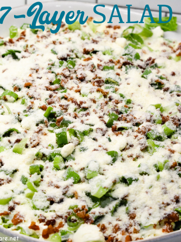 Overnight lettuce salad is my grandmother's version of 7 layer salad made with lettuce, cauliflower, mayonnaise, onions, celery, bacon, and parmesan cheese.