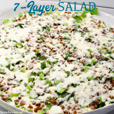 Overnight lettuce salad is my grandmother's version of 7 layer salad made with lettuce, cauliflower, mayonnaise, onions, celery, bacon, and parmesan cheese.