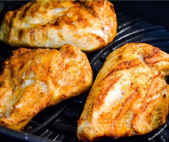 Cajun chicken alfredo with smoked sausage combines air fryer grilled chicken with andouille sausage pan sauteed in a skillet with garlic before being combined with a creamy parmesan cajun alfredo sauce.