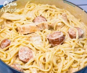 Cajun smoked sausage and chicken alfredo combines air fryer grilled chicken with pan sauteed in a skillet with garlic before being combined with alfredo and a creamy parmesan alfredo sauce.