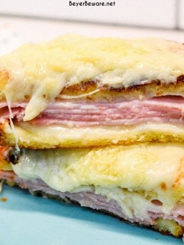 Croque Monsieur is an over the top grilled ham and cheese sandwich recipe that is made with King's Hawaiian bread, Smithfield smoked ham, swiss and gruyere cheese, and a mustard Bechamel sauce.