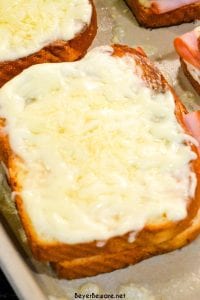 Croque Monsieur is an over the top grilled ham and cheese sandwich recipe that is made with King's Hawaiian bread, Smithfield smoked ham, swiss and gruyere cheese, and a mustard Bechamel sauce.