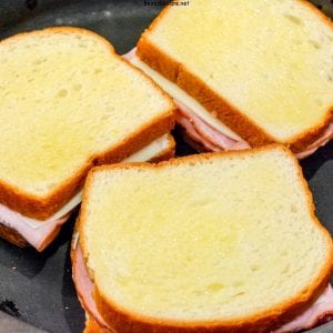 Croque Monsieur is an over the top grilled ham and cheese sandwich recipe that is made with King's Hawaiian bread, Smithfield smoked ham, swiss and gruyere cheese, and a mustard Bechamel sauce.