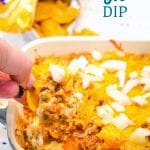 Sloppy Joe Dip has a cream cheese base and topped with an easy sloppy joe ground beef mixture and topped off with shredded cheese and onions, baked to a gooey, meaty goodness and then scooped up with corn chips.