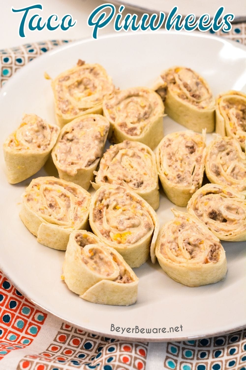 Taco pinwheels are the perfect way to use up leftover taco meat and tortilla shells in a different way than just as tacos again by simply mixing cream cheese, salsa, and taco meat together and spreading over the tortilla shell before rolling up into a pinwheel.