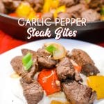 Garlic pepper steak bites recipe is an easy cast iron steak skillet meal made with an easy marinated sirloin steak, garlic, onions, and bell peppers served over mashed potatoes or rice.