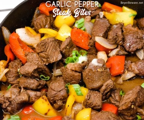 Garlic pepper steak bites recipe is an easy cast iron steak skillet meal made with an easy marinated sirloin steak recipe, garlic, onions, and bell peppers served over mashed potatoes or rice.