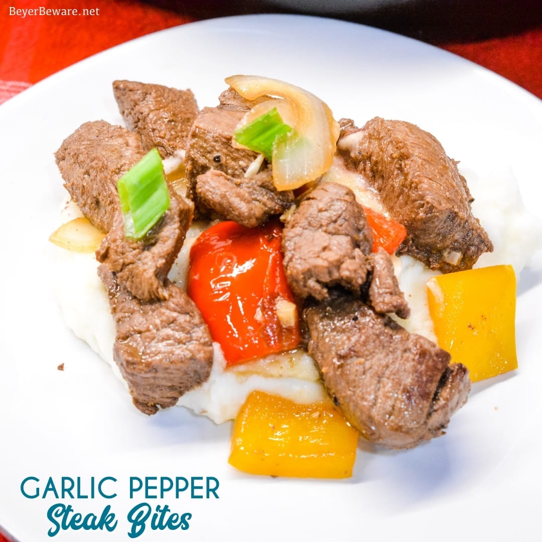 Garlic pepper steak bites recipe is an easy cast iron steak skillet meal made with an easy marinated sirloin steak recipe, garlic, onions, and bell peppers served over mashed potatoes or rice.