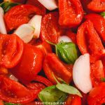 Tomato basil sauce is easy to make by oven roasting the tomatoes, garlic, onions, basil, and olive oil before pureeing into the sauce.