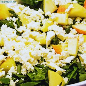 Apple spinach salad is a sweet and savory mixture of spinach, apples, pecans, cranberries, and feta cheese finished with a maple dijon vinaigrette.