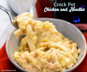 Easy Crock Pot Chicken and Noodles is made by slow cooking chicken, onions, celery, and garlic all day and then adding Reames wide noodles.