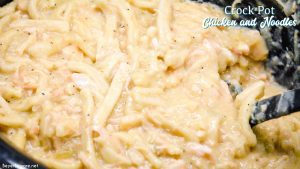 Easy Crock Pot Chicken and Noodles is made by slow cooking chicken, onions, celery, and garlic all day and then adding Reames wide noodles.