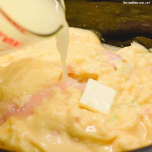 Easy Crock Pot Chicken and Noodles is made by slow cooking chicken, onions, celery, and garlic all day and then adding Reames wide noodles.