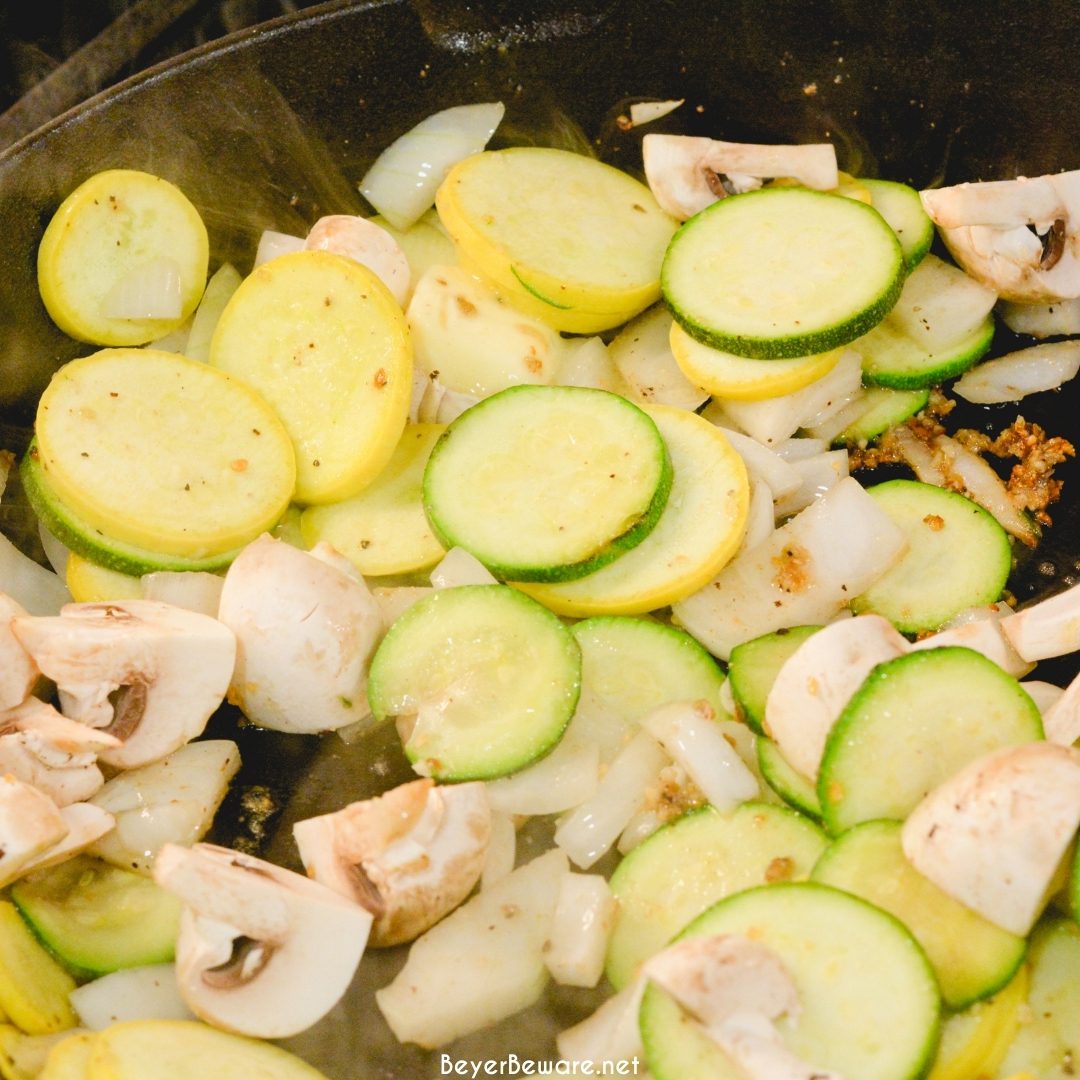 Skillet zucchini and summer squash recipe with corn and mushrooms is a quick sauteed squash recipe that comes together with lots of flavors thanks to onions, garlic, and fresh herbs.