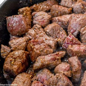 Stew meat sautéing in the skillet