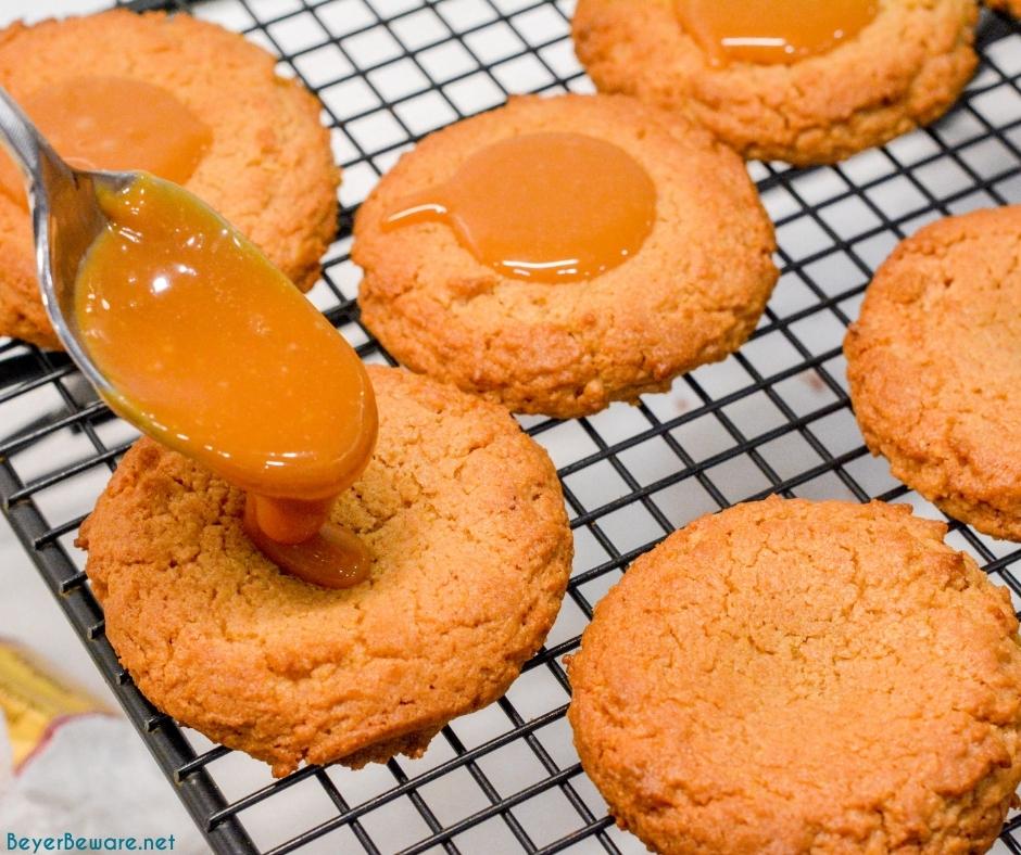 Peanut Butter caramel cookies are an easy non-chocolate Christmas cookie recipe that is easy to make with a cookie mix for peanut butter blossoms with caramel.