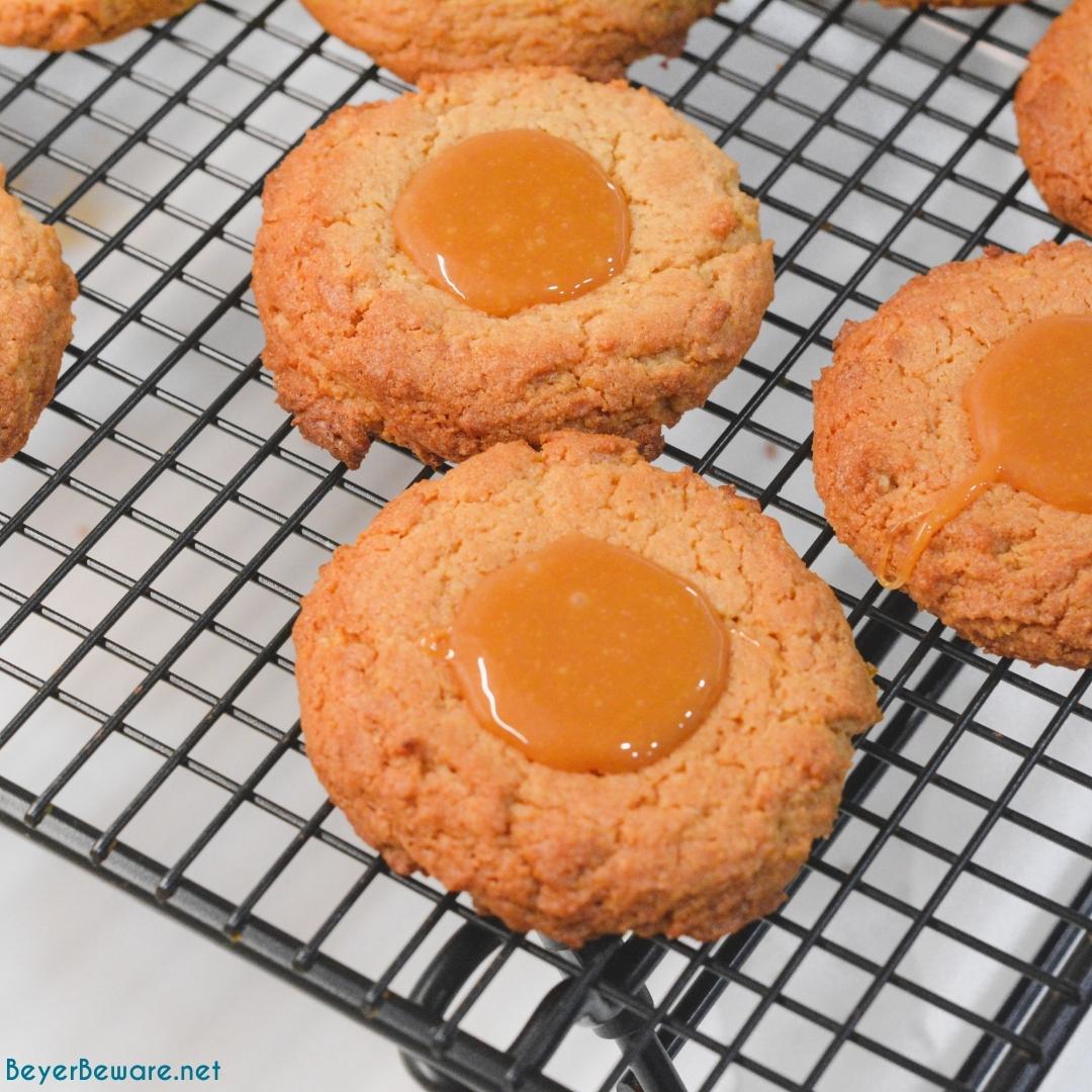 Peanut Butter caramel cookies are an easy non-chocolate Christmas cookie recipe that is easy to make with a cookie mix for peanut butter blossoms with caramel.