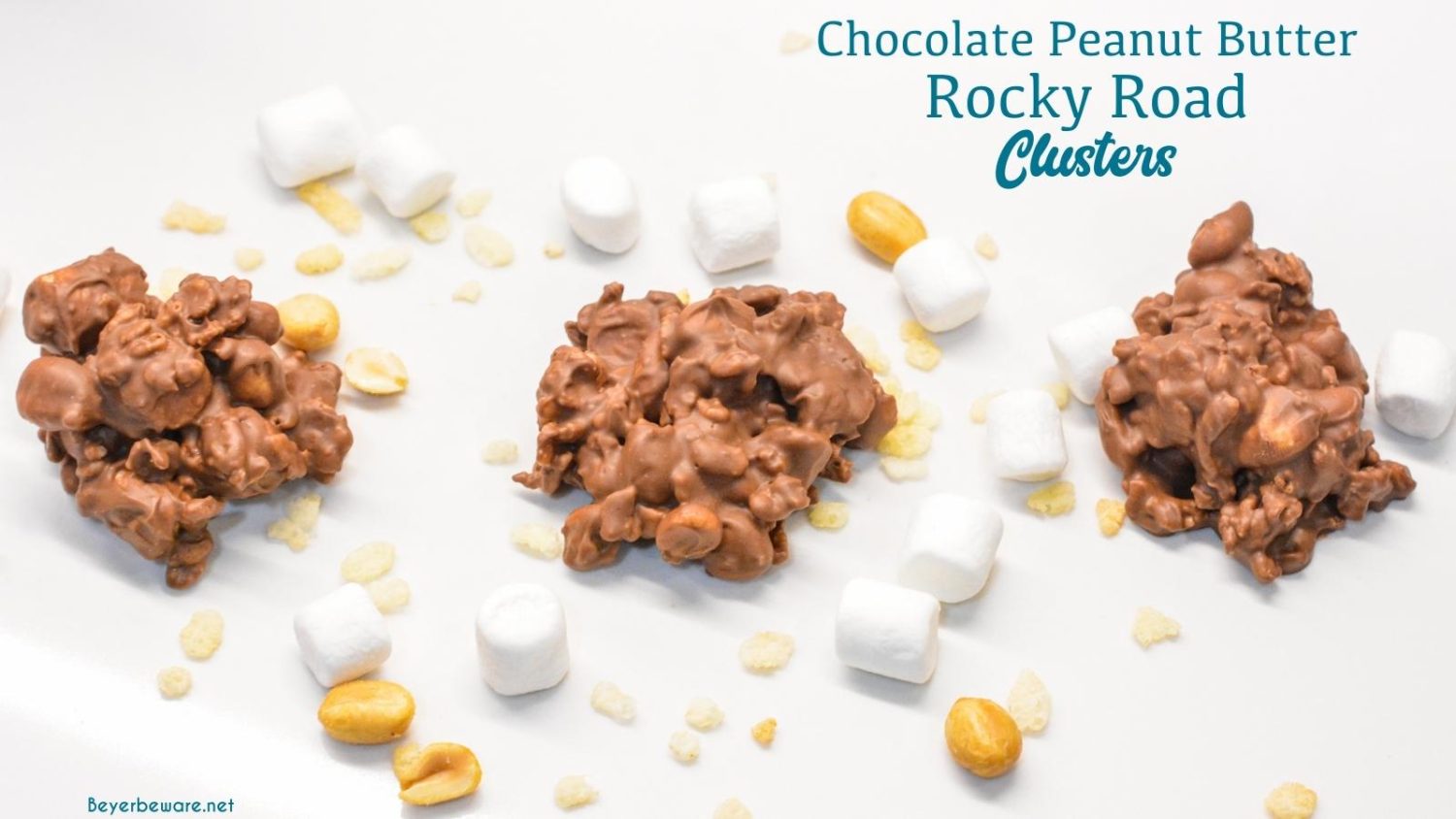 Chocolate peanut butter rock road clusters combine peanut, marshmallows, and rice krispies with melted dark and white chocolate and peanut butter for over-the-top peanut clusters.