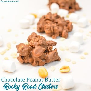 Chocolate peanut butter rock road clusters combine peanut, marshmallows, and rice krispies with melted dark and white chocolate and peanut butter for over-the-top peanut clusters.