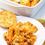 Mostaccioli bake is a hearty Italian casserole made with pasta, sausage, tomato sauce, cheese, and lots of seasoning.