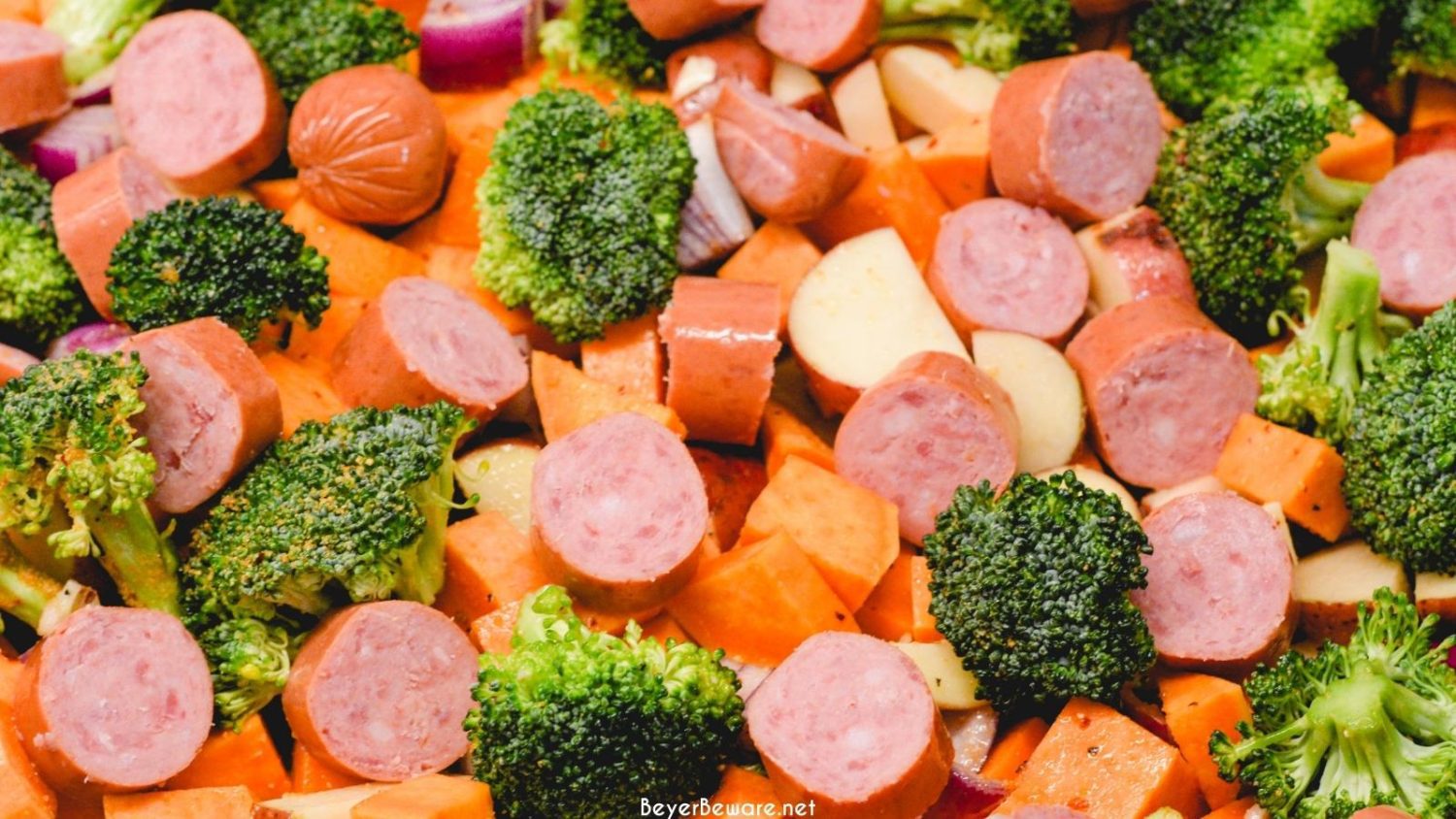 Sheet pan smoked sausage, potatoes, and broccoli is a simple oven roasted sausage and sweet potatoes meal that is full of flavors from onions and garlic and roasted in 45 minutes.