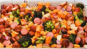 Sheet pan smoked sausage, potatoes, and broccoli is a simple oven roasted sausage and sweet potatoes meal that is full of flavors from onions and garlic and roasted in 45 minutes.