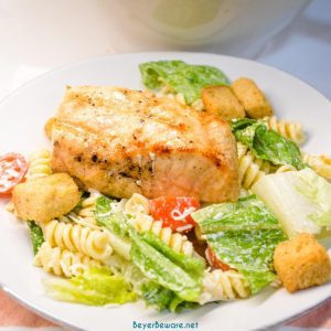 Caesar Pasta Salad is a great side salad or base for grilled chicken or salmon and is easily put together with romaine lettuce, pasta, cherry tomatoes, parmesan cheese, croutons, and Caesar salad dressing. 