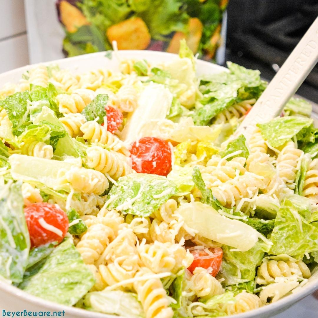 Caesar Pasta Salad is a great side salad or base for grilled chicken or salmon and is easily put together with romaine lettuce, pasta, cherry tomatoes, parmesan cheese, croutons, and Caesar salad dressing. 