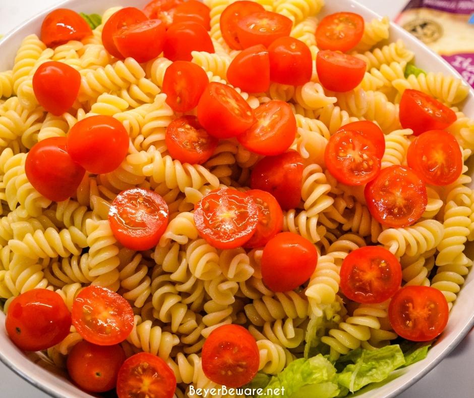 Caesar Pasta Salad is a great side salad or base for grilled chicken or salmon and is easily put together with romaine lettuce, pasta, cherry tomatoes, parmesan cheese, croutons, and Caesar salad dressing. 