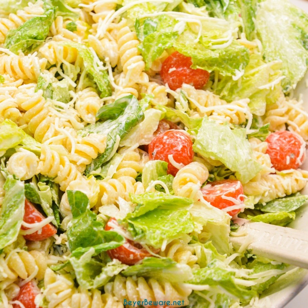 Caesar Pasta Salad is a great side salad or base for grilled chicken or salmon and is easily put together with romaine lettuce, pasta, cherry tomatoes, parmesan cheese, croutons, and Caesar salad dressing. 