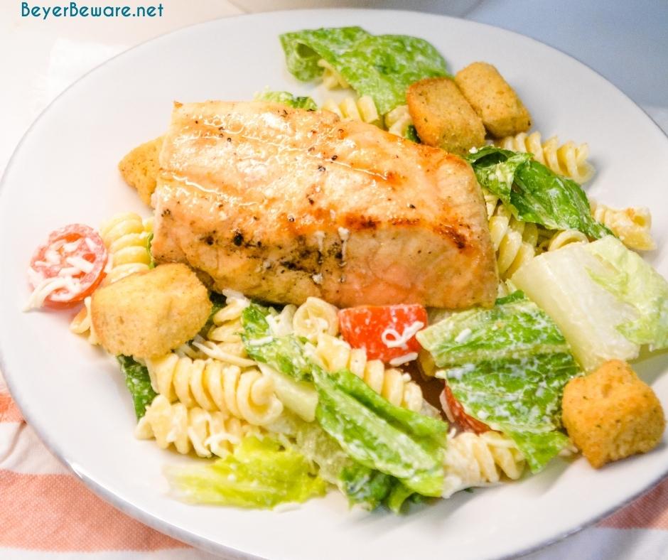 Caesar Pasta Salad is a great side salad or base for grilled chicken or salmon and is easily put together with romaine lettuce, pasta, cherry tomatoes, parmesan cheese, croutons, and Caesar salad dressing. 