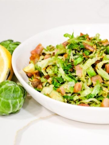 Shaved Brussels Sprouts with bacon sautéed on the stovetop and finished off with some lemon juice is the fastest way to make Brussels sprouts side dishes.