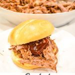 The simple smoked pulled pork recipe can be made with either a pork shoulder or Boston butt with a simple rub and about 6-8 hours on the Big Green Egg followed by an hour resting before you shred the pork up for an amazing smoked BBQ sandwich.