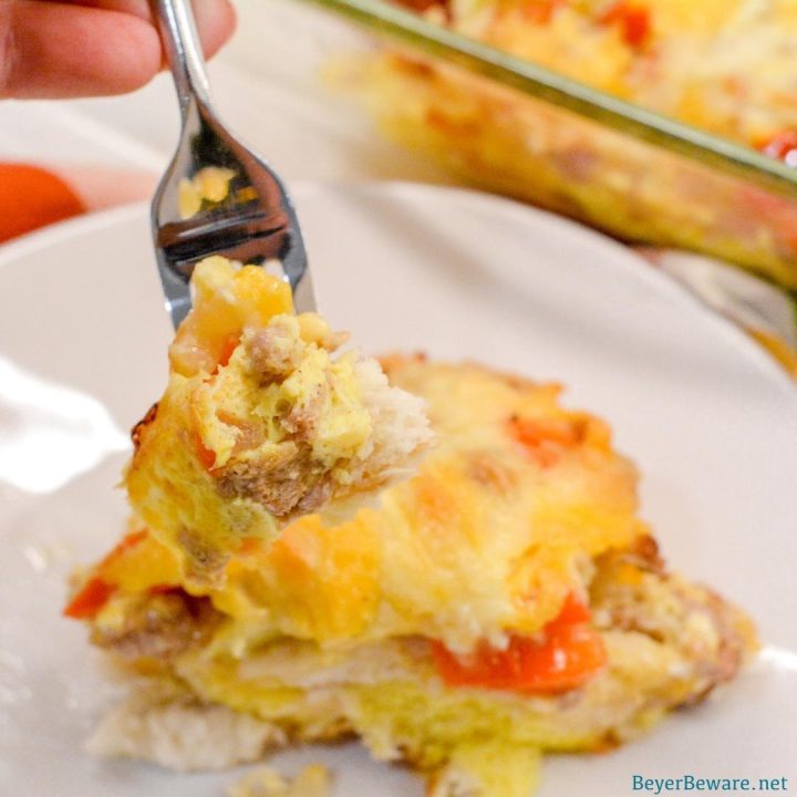 The Biscuit Quiche Recipe is easy to make with just refrigerator biscuits, breakfast sausage, bell peppers, onions, cheese and scrambled eggs. 