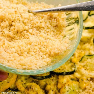 Transfer to a greased 13 X 9 casserole dish. Melt remaining butter and mix with breadcrumbs and parmesan. Spread over the casserole.