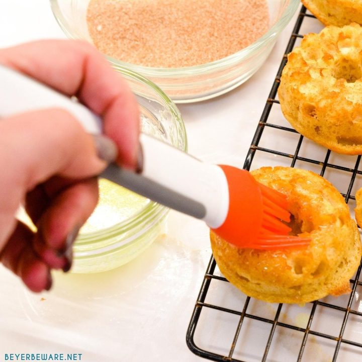 Brush melted butter on the apple cider donut muffins and then dip in cinnamon and sugar