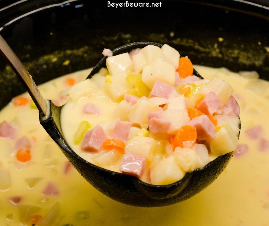 Crock pot ham and potato soup is slow-cooked all day in a base of carrots, celery, onions, and garlic along with diced potato hash browns, ham, and cream cheese to make a hearty soup dinner.