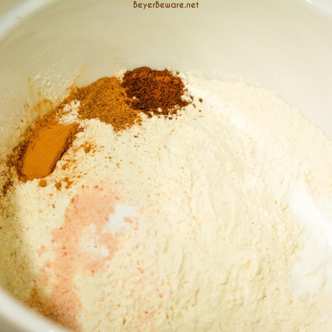 Start by combining the flour, salt, baking powder, baking soda, and spices. 