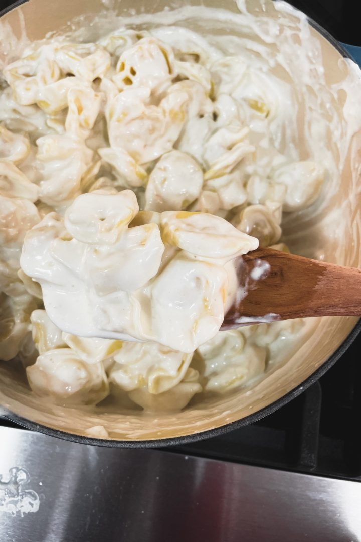 This easy Alfredo sauce with cream cheese recipe made with five ingredients in under 10 minutes is the base for many fast weeknight meals.