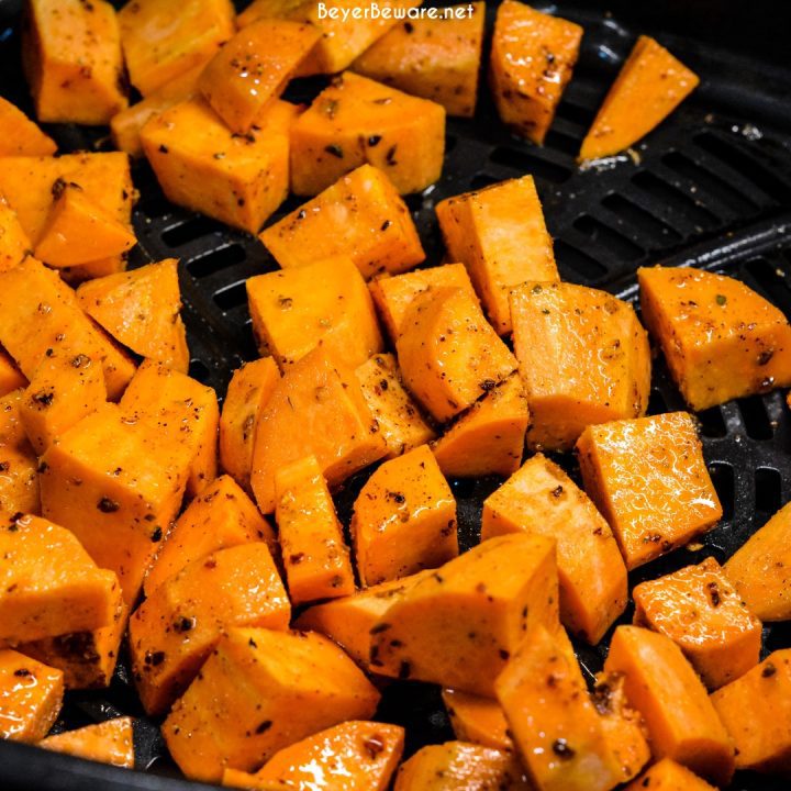 In a preheated 390-degree air fryer, dump the cubed potatoes.