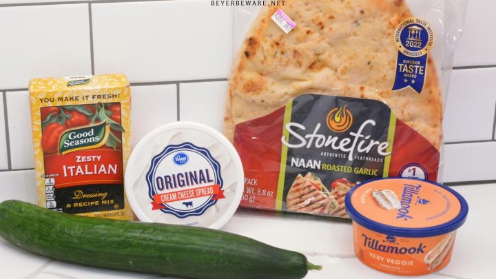 Cucumber pizza ingredients are naan bread, cream cheese, Italian seasoning, and cucumbers