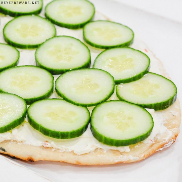 Top off with the sliced cucumber slices. Chill before serving. Slice to serve.