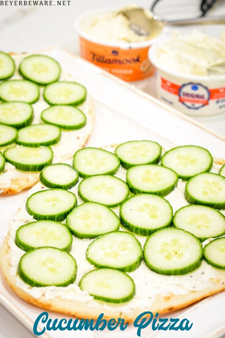 Cucumber pizza is a simple no-bake appetizer made with naan bread, cream cheese, Italian seasoning, and cucumbers cut into cucumber bites.